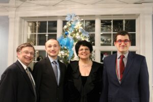 Family Photo In Lobby, in front of Christmas tree