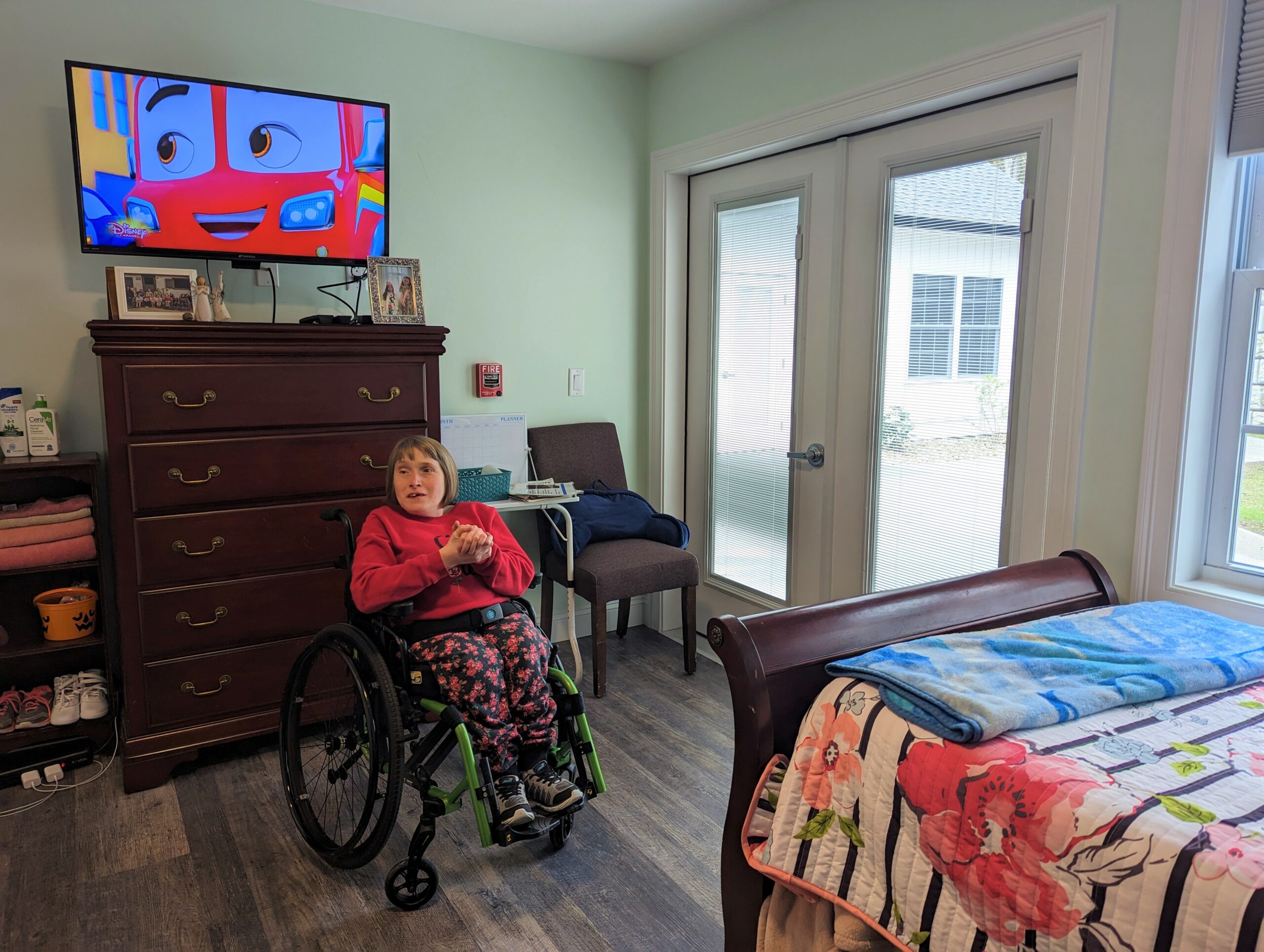 Handicapped woman in her bedroom