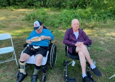 Summer BBQ Two Men Eating